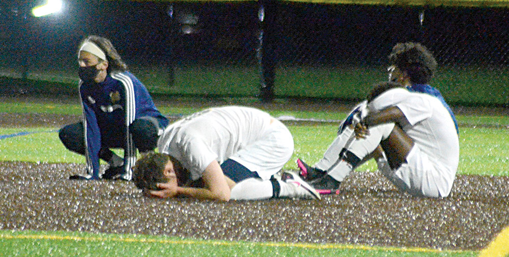 The Bushmen react after losing the Section 9 Class AA finals on penalty kicks on April 20 at Monroe-Woodbury High School in Central Valley.